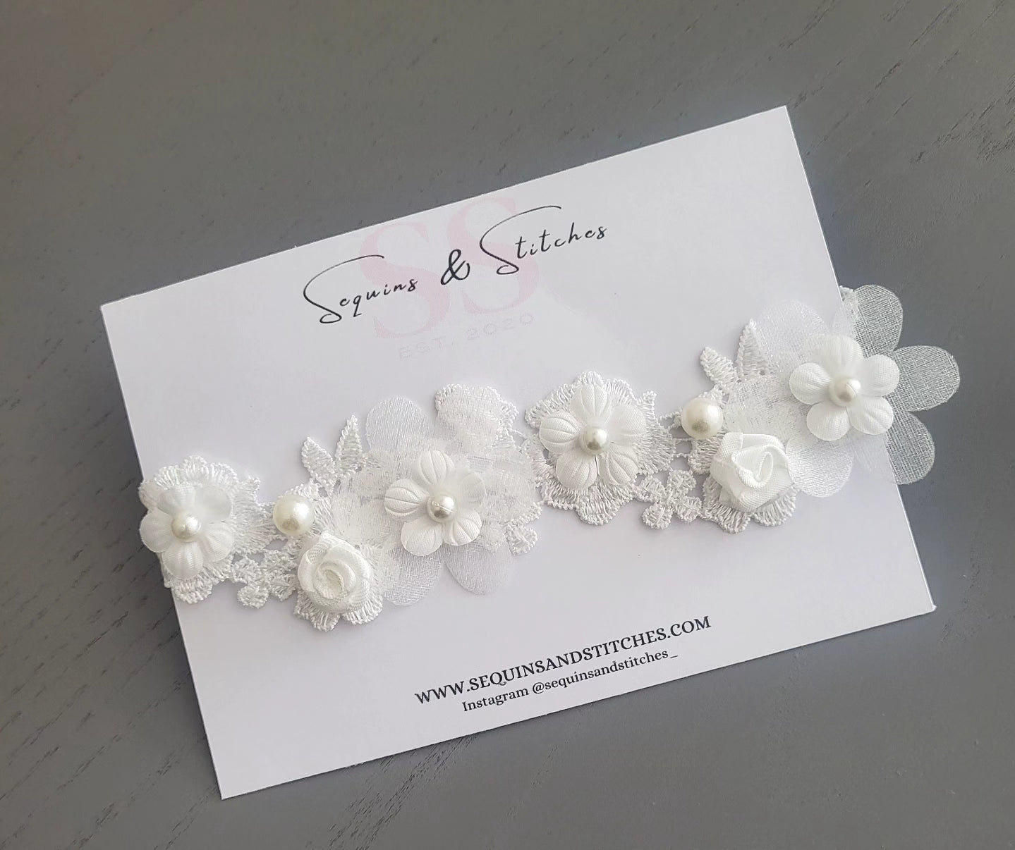 Elegant pearl embellished rose lace headpiece.