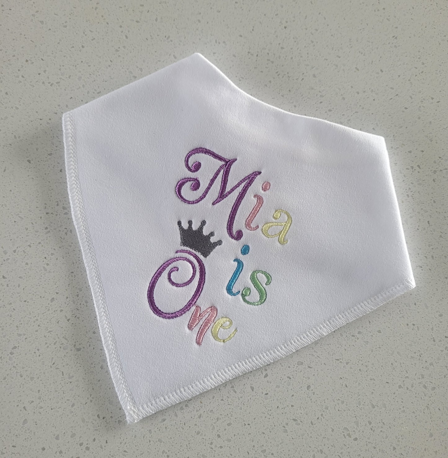 Multi-coloured birthday bib